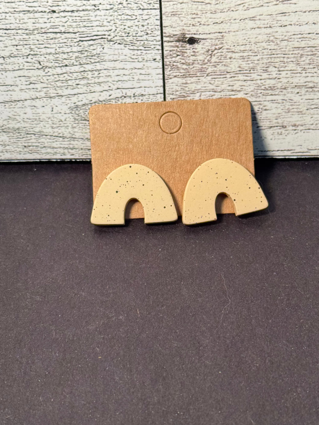 Tan and black speckle arch studs