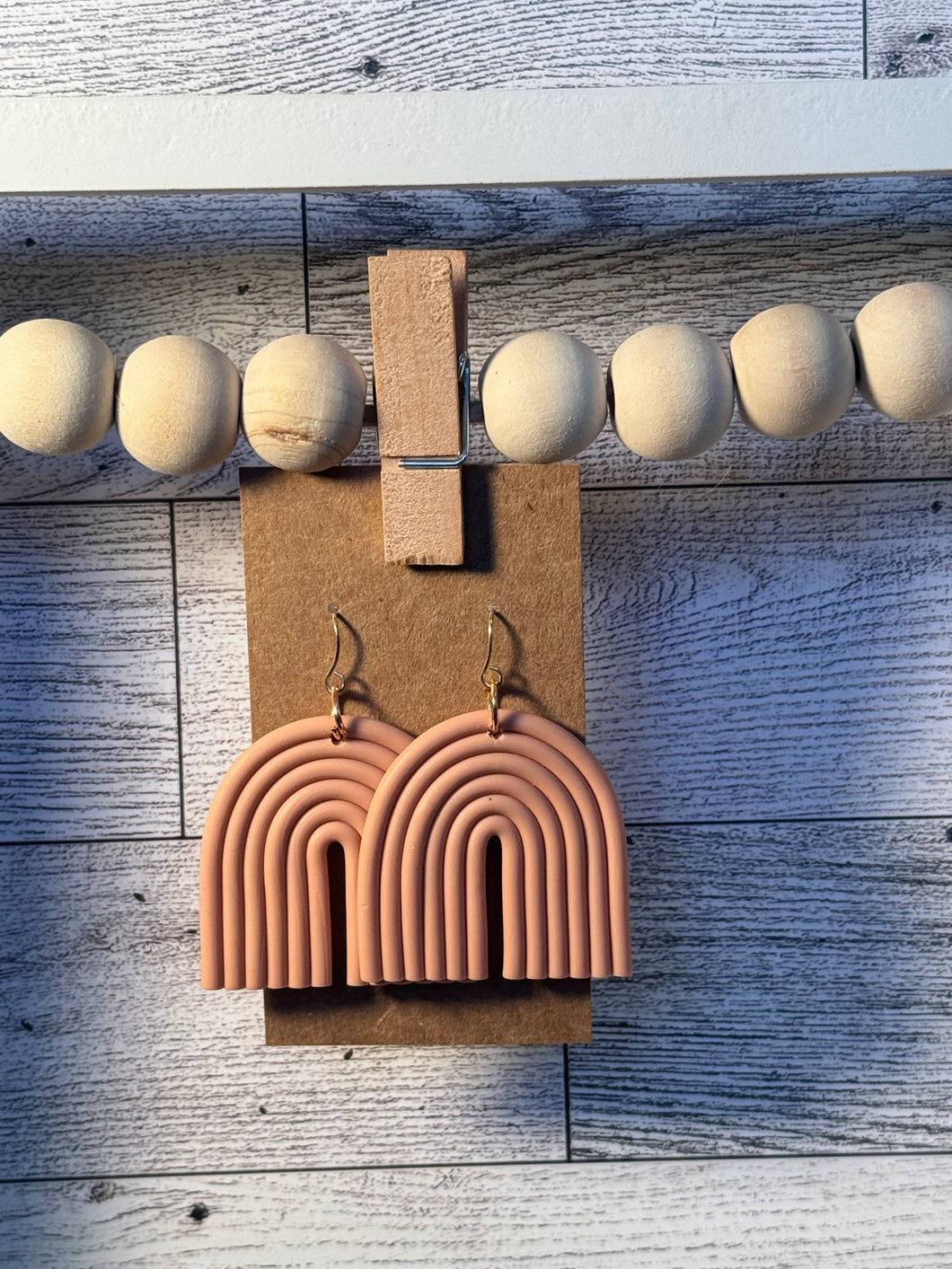Pale pink arch earrings