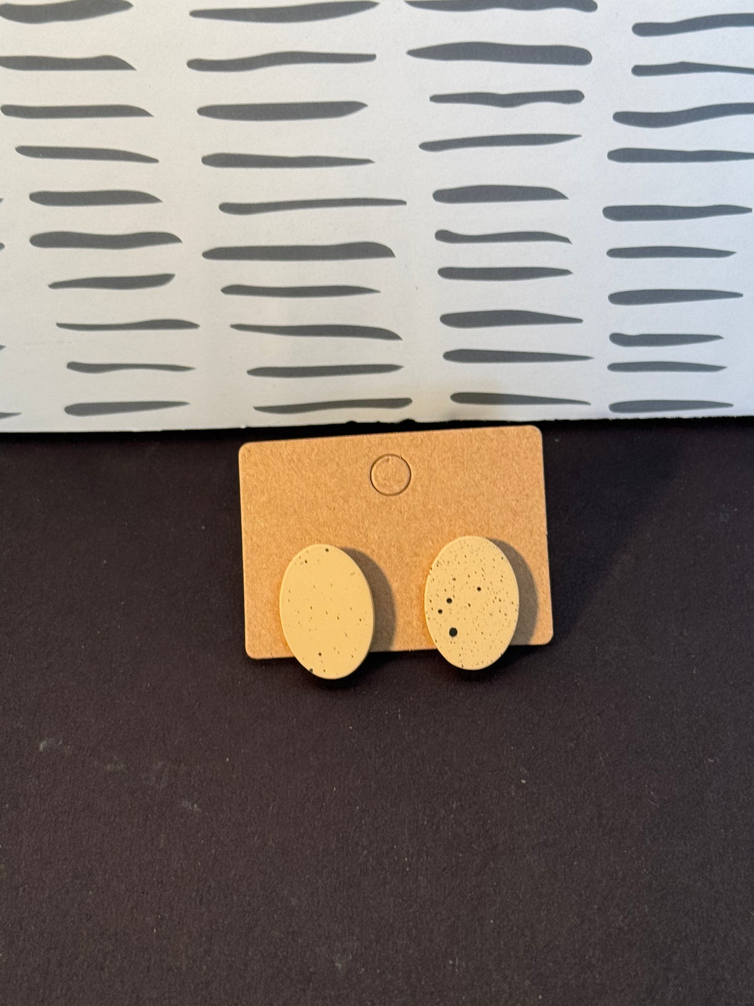 Tan and black speck studs