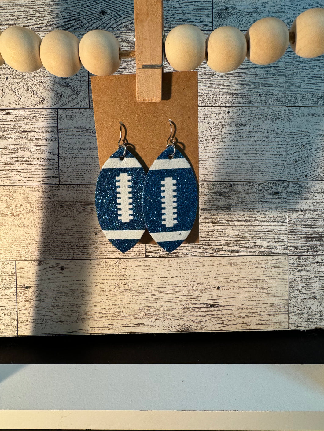 Blue Glitter Football Earrings